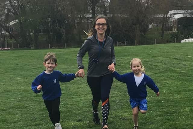 Sharon Darke running with two Hill View Primary School pupils