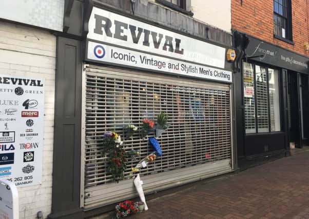 Flowers were laid outside Revival menswear on Parsons Street after the death of shop owner Nik Hale NNL-190304-100234001