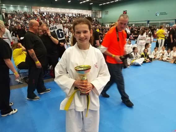 Gold winning student Charlotte Carter with trophy NNL-190404-090014002