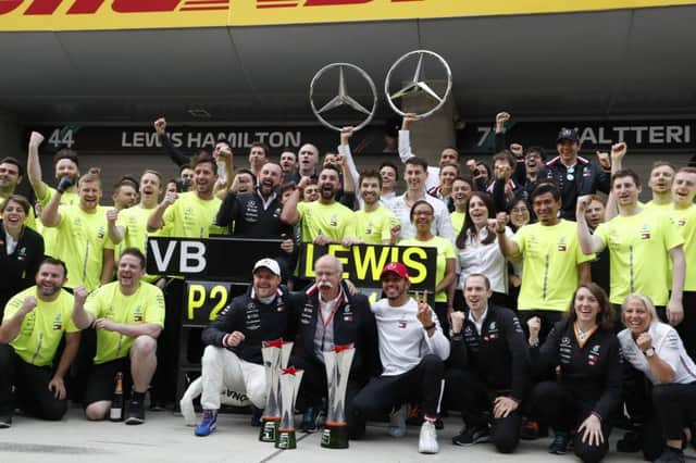 Lewis Hamilton and Valtteri Bottas celebrate another one-two with the Mercedes AMG Petronas team in China