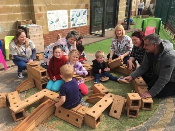 Children and adults play with the blocks at The Sunshine Centre's Easter fun day, won through Oxfordshire County Council