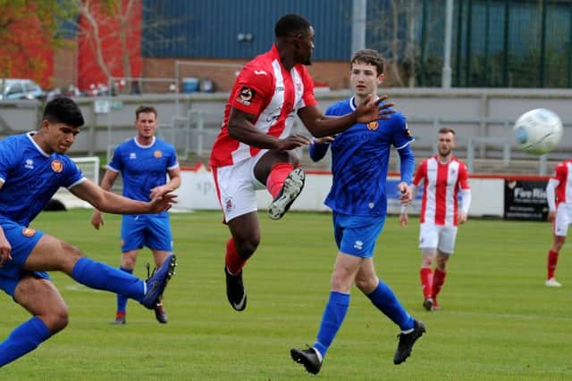 Top scorer Lee Ndlovu is thwarted during Brackley Town's game against FC United of Manchester. Photo: Jake McNulty