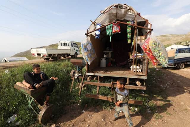 Syrian children in a makeshift camp in the Hama province not far from Turkish troops. Photo: Getty Images
