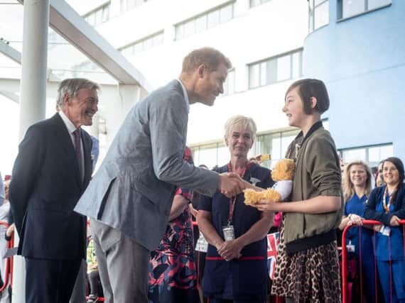 The Duke of Sussex outside Oxford Children's Hospital with Daisy Wingrove. Photo: OUH