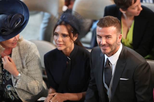 David and Victoria Beckham at Harry and Meghan's wedding at St George's Chapel. Picture by Danny Lawson/PA Wire PPP-180522-160451001