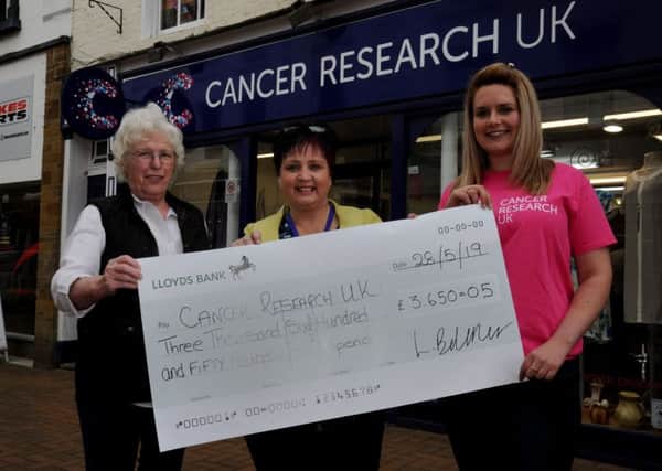 Cancer Research UK, Banbury, Tractor Run cheque presentation. From the left, Joy Hancox, volunteer, Tracey Kathona, shop manager and Laura Belcher, Tractor Run organizer. NNL-190528-105435009