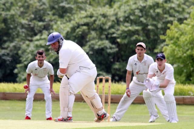 Sandford St Martin batsman Jim Howe deals with a delivery as Great Brickhill II wicket keeper Jarvis Hunt and slips Maicol Javed and Drew Burrows get set. Photo: Steve Prouse