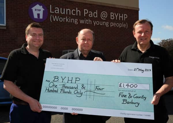 Fine and Country Estate Agents present a cheque to BYHP, Banbury. Terry Robinson, left and Chris Mobbs, right, Fine and Country, with Patrick Vercoe, BYHP CEO, in the middle. NNL-190521-131341009