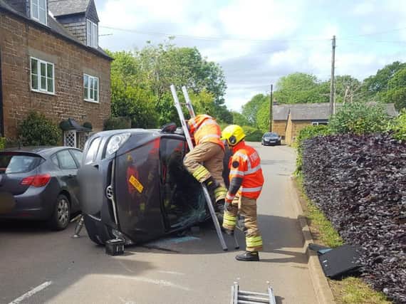 Firefighters at the scene of the crash in Edgehill. Photo: Warwickshire Fire and Rescue Service