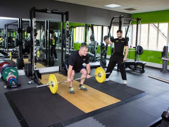 Jay Sullivan working out at Bannatyne's Health Club and Spa with fitness manager Nick Acock. Photo: Bannatyne's Fitness