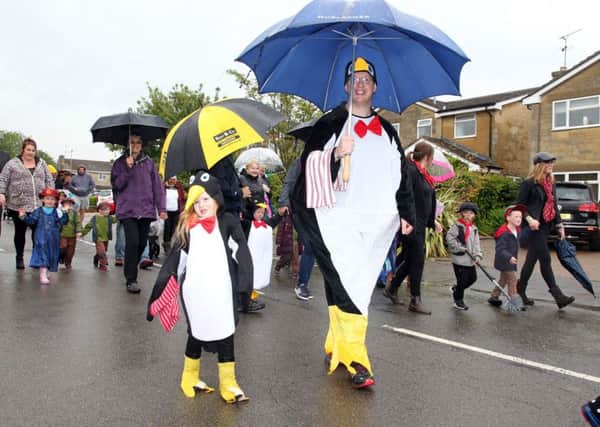Brackley Carnival. Even the penguins needed umbrellas to keep off the rain! NNL-190906-163117009