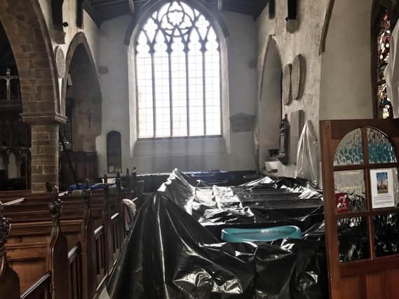The community has come together to help protect The Church of St Peter and St Paul's interior while the roof is repaired. Photo supplied by the church