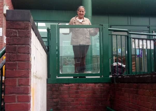 Banbury Town Councillor Surinder Dhesi and the Castle Quay lift which has now been fixed NNL-190618-110803001