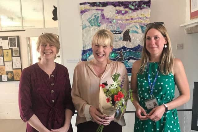 Artist Nancy Cadogan with staff from Culworth Primary Academy at the exhibition launch at Forge Coffee NNL-190626-101035001