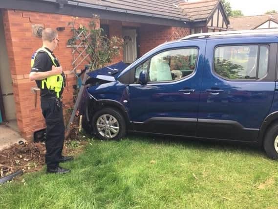 The car was severely damaged after hitting the house in Banbury. Photo: Oxfordshire Fire and Rescue Service