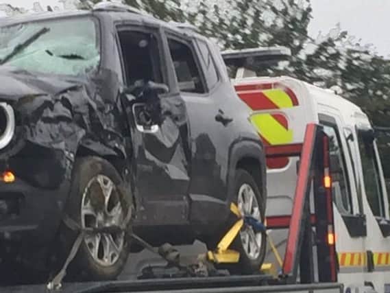The damaged car being taken away after the crash near King's Sutton. Photo: Northamptonshire Police/Twitter