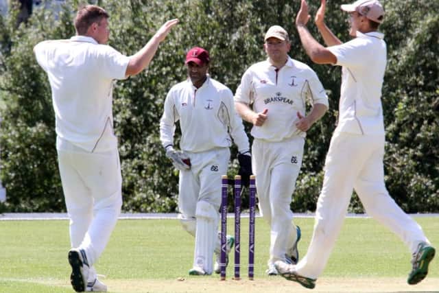 Banbury's David Whitely, Shazad Rana, Richard West and captain Lloyd Sabin celebrate another wicket against Finchampstead at White Post Road. Photo: Steve Prouse