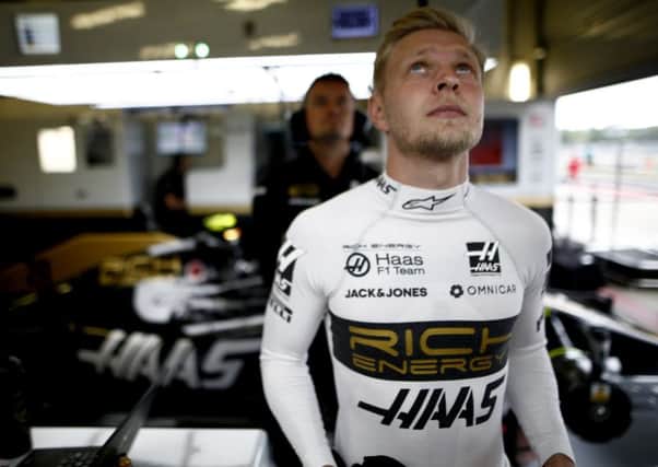 Rich Energy Haas F1 team driver Kevin Magnussen keeps a watch on qualifying times at Silverstone. Photo: Andy Hone