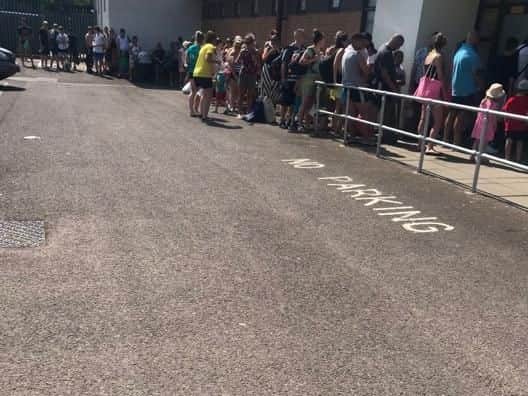 People have waited hours in the heat; others have given up and gone home. Picture by Louise Armstrong