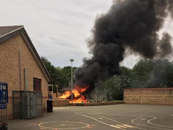 The smoke billows upwards from the torched playground - picture on Hook Norton Facebook group