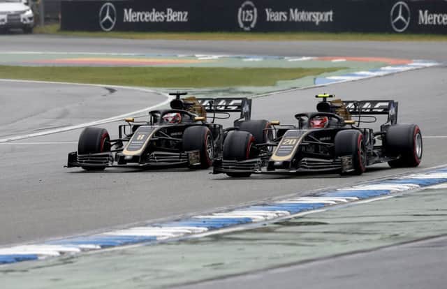 Romain Grosjean and Kevin Magnussen on their way to top ten finishes in Sunday's German Grand Prix