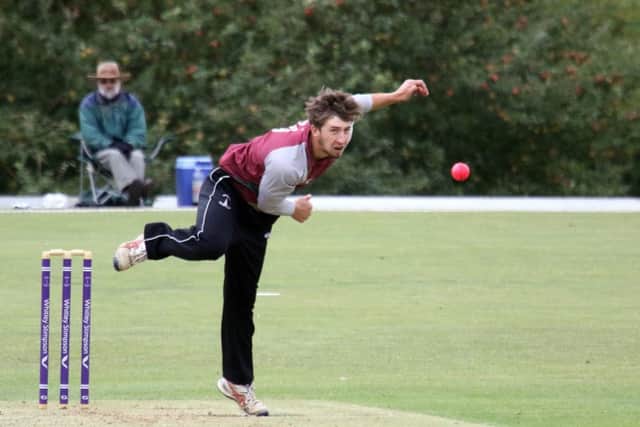 Banbury bowler Charlie Hill sends down a delivery against Buckingham Town at White Post Road. Photo: Steve Prouse