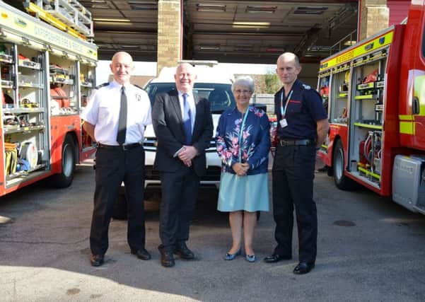 West Oxfordshire Neighbourhood Police Inspector, Steve Hookham; County Councillors Ian Hudspeth and Judith Heathcoat; and Chief Fire Officer for Oxfordshire County Council Fire and  Rescue Service, Rob MacDougall at the unveiling of a new partnership between Oxon Fire and Rescue and Chipping Norton's neighbourhood policing team. NNL-190924-110905001