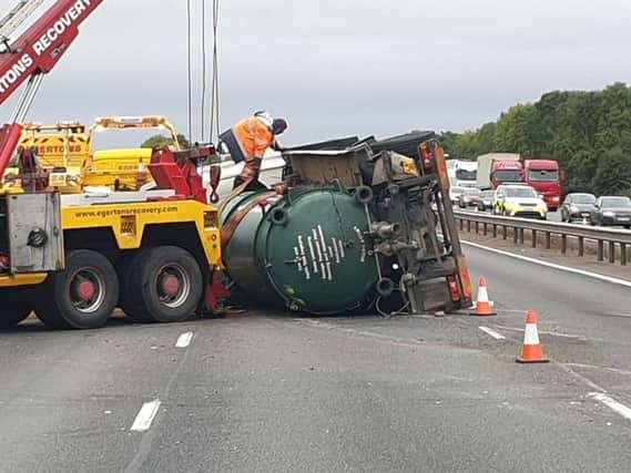 A recovery crane lifts the overturned tanker. Picture by Thames Valley Police Roads Policing