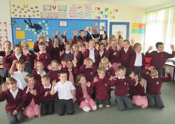 Children from All Saints Juniors in Warwick learning about under-sea diving.