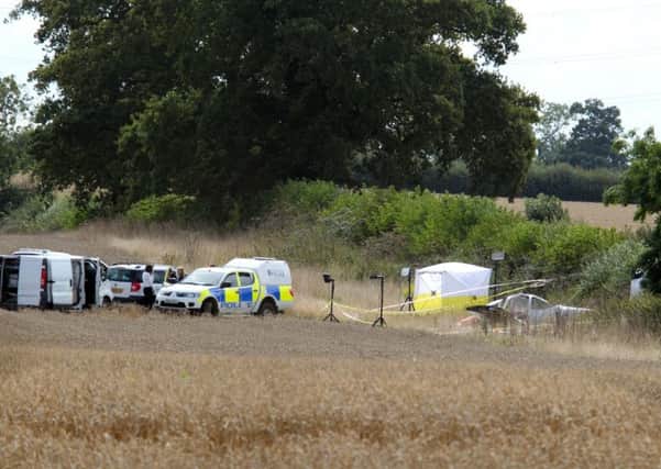 Police and Accident Investigation attend the aftermath of a fatal light aircraft crash in a farmers field near Padbury PNL-140821-124633009
