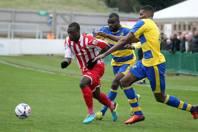 Brackley Town's Greg Kaziboni gets away from Junior English and Michael Nottingham during Saturday's defeat against and Solihull Moors