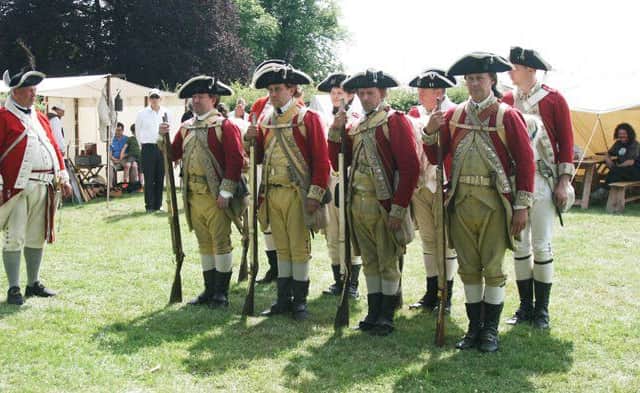 The Redcoats line up in formation. Picture by Colin Wootton. NNL-150607-114024001