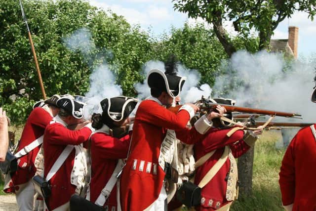 Musket fire fills the air as the Redcoats show off their skills. Picture by Colin Wootton. NNL-150607-113958001
