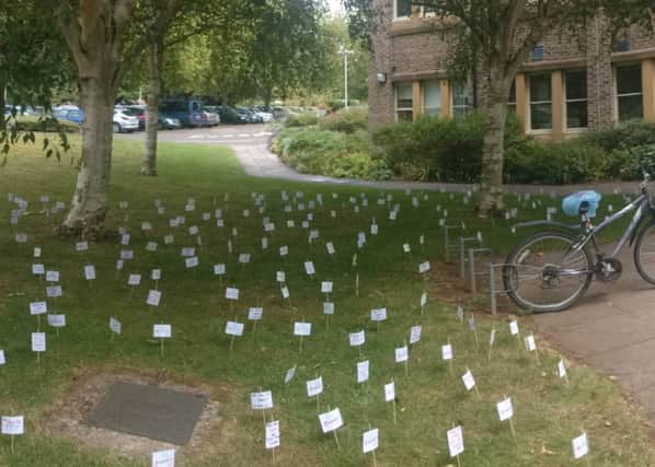 A protester left almost a hundred of the miniature placards outside Cherwell District Council's offices at Bodicote House. NNL-150807-151553001