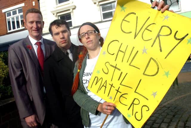 Labour councillors Mark Cherry and Sean Woodcock with Jill Huish -  service user at a children's centre protest back in 2013 in Banbury. ENGNNL00120130211132522