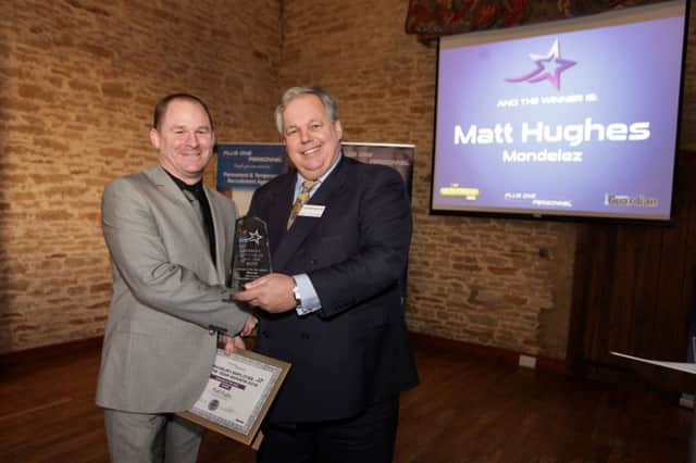 Matt Hughes of Mondelez International collects the Employee of the Year  award from former Banbury MP Sir Tony Baldry at last year's ceremony. NNL-151027-111726001