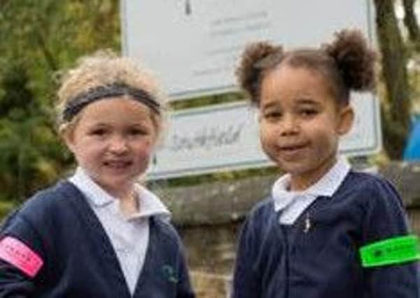 Children from Southfield Primary Academy in Brackley celebrating International Walk to School month by wearing high visibility armbands donated by Barratt Homes Northampton. NNL-151029-130658001