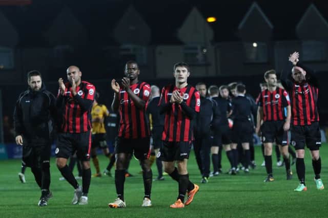 Brackley Town players applaud their travelling supporters at the end of the game