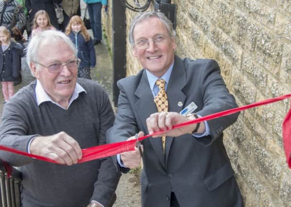 Peter Renshaw, chairman of the trustees of Viridor Credits Environmental Company officially opening new and refurbished facilities at Middle Barton Playing Fields with Tony Reed, chairman of the management committee of the Bartons Victory War Memorial Hall Fund. NNL-161201-122751001
