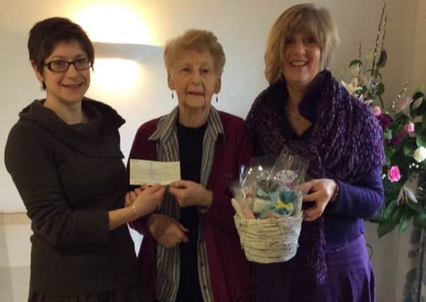 From left to right is Sarah Brennan of Katharine House Hospice receiving the cheque from Margaret Whittle and Ursula Heyland with the Lavender sachets. NNL-160119-154537001