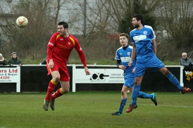 Ricky Johnson completes his hat-trick with a header against Larkhall Athletic