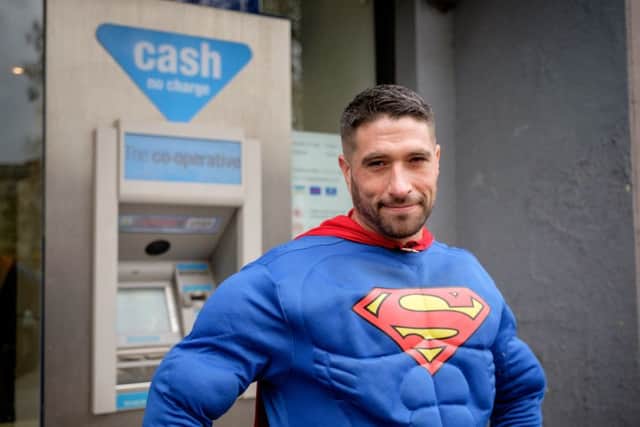 Antonio outside the cashpoint where the incident took place. Photo: SWNS
