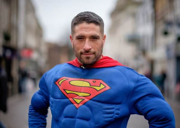Antonio Cortes, was dressed as Superman when he saved a woman from a robbery at a cashpoint. Photo: SWNS