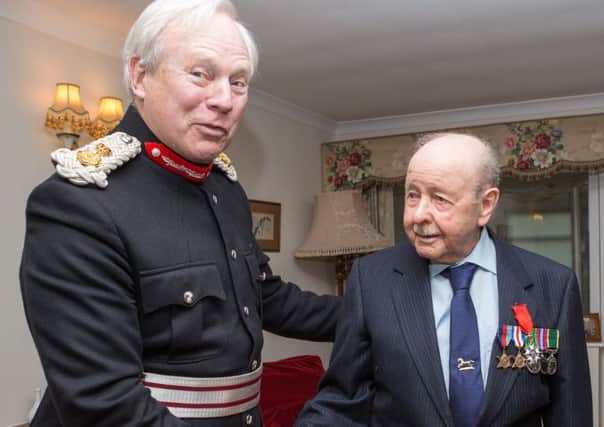 Lord-Lieutenant of Northants David Laing, presents the Legion d'Honneur to Aynho D-Day soldier Peter Smith, 94. NNL-160902-121235001