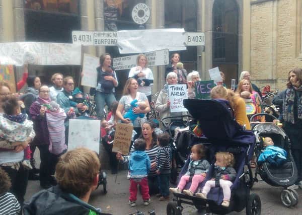 Families and users of children's centres in Oxfordshire protesting outside Oxfordshire County Council last year in response to drastic changes to the provision of children's centres and early intervention services in the county. Picture by Jill Huish. NNL-150909-105729001