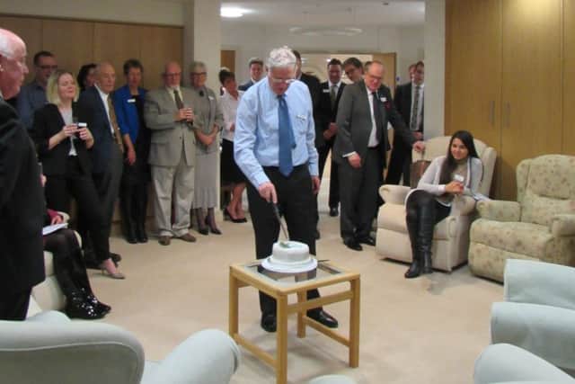 Outgoing chairman Neil Gadsby cuts a celebratory cake to mark 25 year since Katharine House Hospice was first created. NNL-160902-165753001