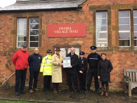 Grenville Moore, chairman of Oxhill Parish Council, with Warwickshire Police and Crime Commissioner Ron Ball outside the village hall with the Fuel Protected Village scheme. NNL-161002-094713001