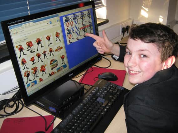 Magdalen College School pupil Seb Hirons with some of the coding that was being taught at the sessions. NNL-161202-165125001