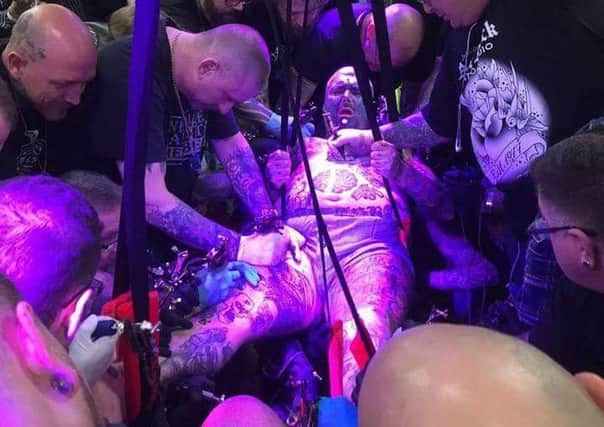 A tattoo world record attempt at the Needle Gangstas Beano Annual Tattoo Expo saw 36 tattoo artists simultaneously tattoo one man. Banbury tattoo parlour Fellowship of the Needle took part. NNL-160223-120022001