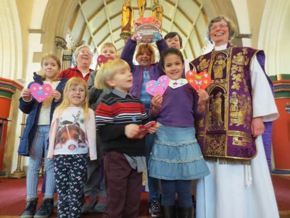 Pictured with the children from L-R are: Sue Ayliff, St Leonard's Children's and Families' Worker, Ven Judy French, Archdeacon of Dorchester and Reverend Sue Burchell, Vicar of St Leonard's. NNL-160223-154141001